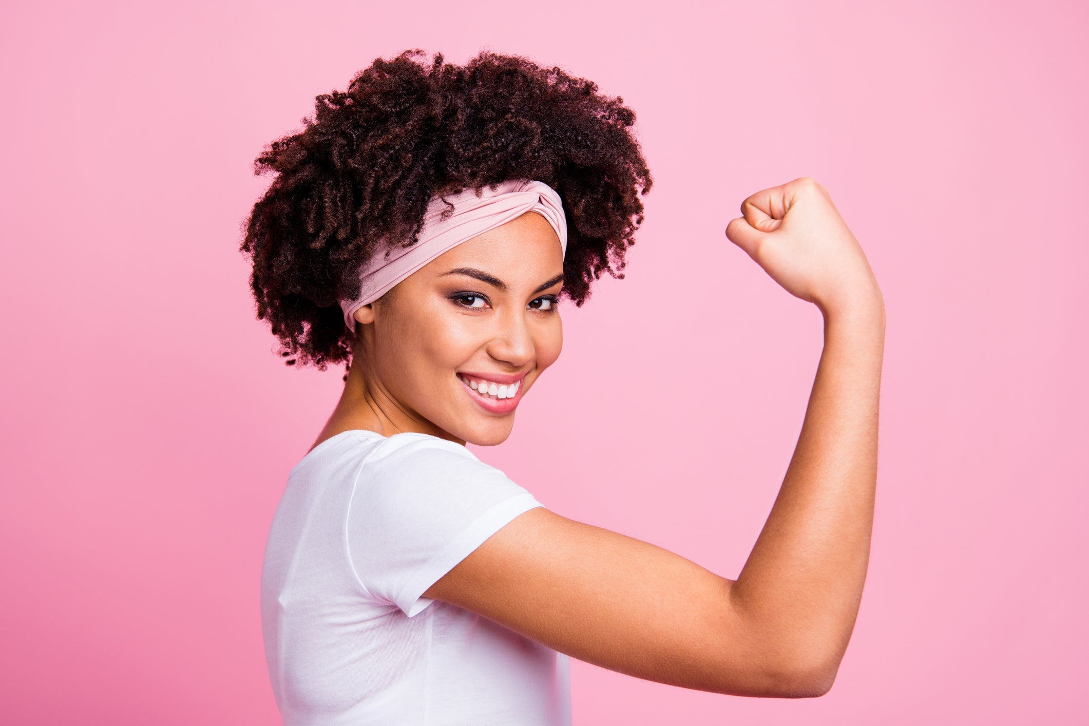 Young Woman Showing Muscle - InterPlexus Blog Synergistic Nutrients for Adrenal Support Part 1